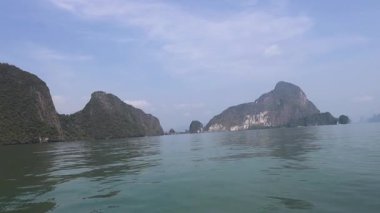 Boat ride through tranquil karst mountain scenery