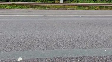 Close-up view of road texture and markings