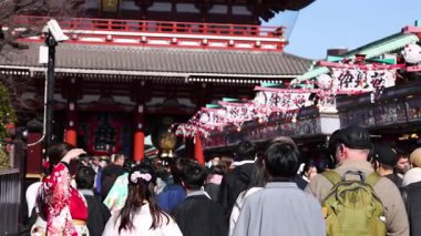 Visitors in traditional attire at temple event