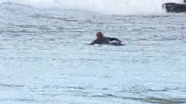 Surfer catching waves in the ocean