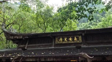 Ancient temple with intricate statues and offerings