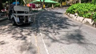 Monkey explores golf cart at Khao Kheow Zoo