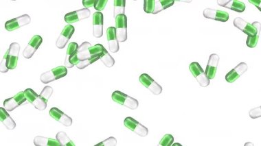 Değişen arka planlara karşı yeşil ve beyaz kapsüller düşüyor
