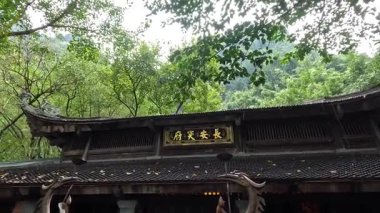 Tourists visiting a traditional Vietnamese temple