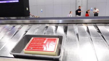 Baggage moving on carousel at airport terminal