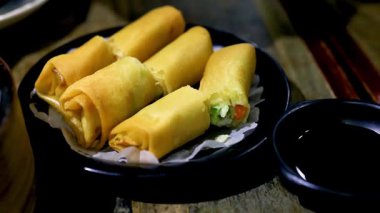 Delicious spring rolls served with dipping sauce