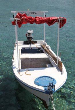 CHIOS,GREECE-JULY 15:Small Wooden Greek Boat Moored in near Pier. July 15,2010 in Chios, Greece