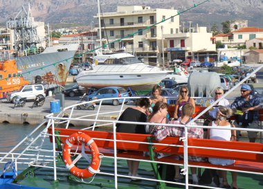 CHIOS,GREECE-JULY 16:Unidentified Tourists waiting for departure at Chios Port on Ferry to Turkey. July 16,2010 in Chios, Greece
