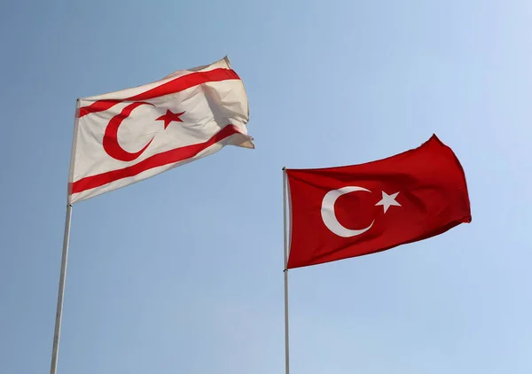 Flags of Turkish Republic of Northern Cyprus and Republic of Turkey flying in the air in Famagusta, North Cyprus