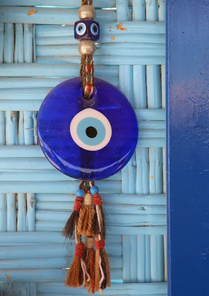 stock image Dusty Old Turkish Evil Eye Charm on The Wall at Restaurant in Famagusta, North Cyprus