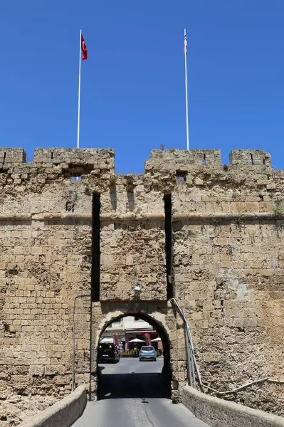 stock image FAMAGUSTA, NORTHERN CYPRUS-AUGUST 30,2023:Land Gate of The Famagusta and Business and Cars Inside  Othello Castle