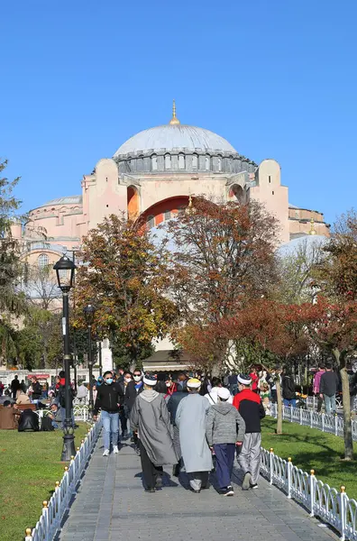 stock image ISTANBUL, TURKEY-OCTOBER 30,2021:Group of Unidentified Religious Young Men in Islamic Outfit walking towards to Hagia Sophia