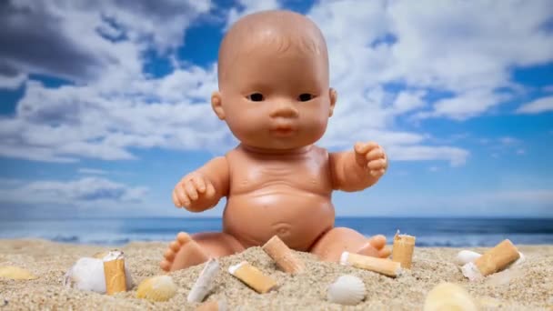 Baby Doll Surrounded Cigarettes Filling Beautiful Beach — Stock Video