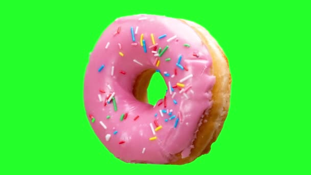 在绿色屏幕背景下旋转的甜甜圈 — 图库视频影像