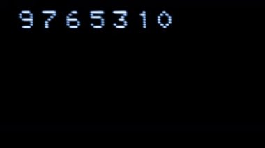 Old style computer typeface writing random numbers on screen