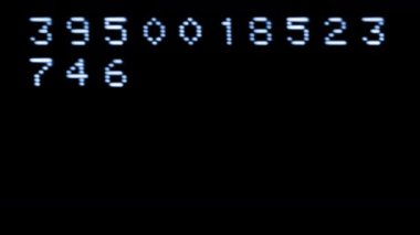 Old style computer typeface writing random numbers on screen