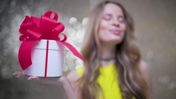 Beautiful Woman Holding Gift Box Red Bow — Stockvideo