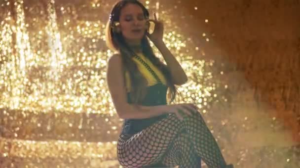Stylish Pretty Woman Posing Dancing Headphones Gold Backdrop — Stockvideo