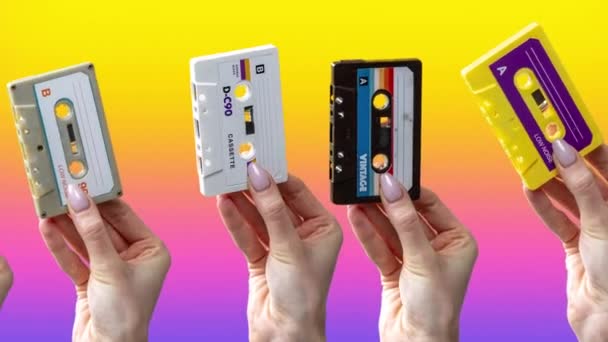 Many Hands Holding Retro Cassette Tapes Abstract Background — Vídeo de Stock