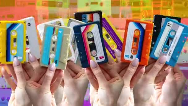Many Hands Holding Retro Cassette Tapes Abstract Background — ストック動画