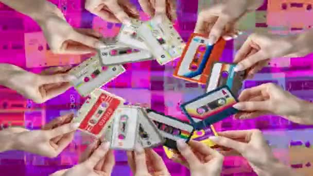 Many Hands Holding Retro Cassette Tapes Made Circular Pattern — Vídeo de Stock