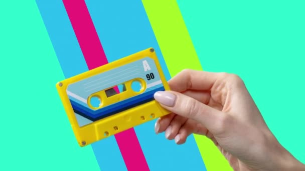 Hand Holding Retro Cassette Tapes — Vídeo de Stock