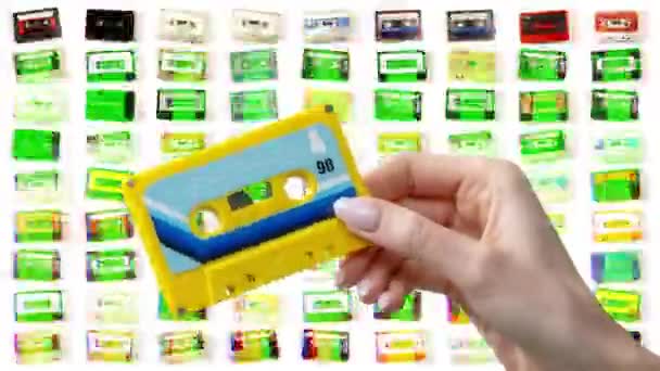 Hand Holding Retro Cassette Tapes — Vídeo de Stock