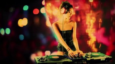 Beautiful female dj playing with turntables