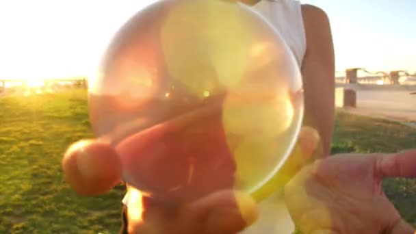 Woman Plays Contact Juggling Glass Transparent Ball — Vídeos de Stock