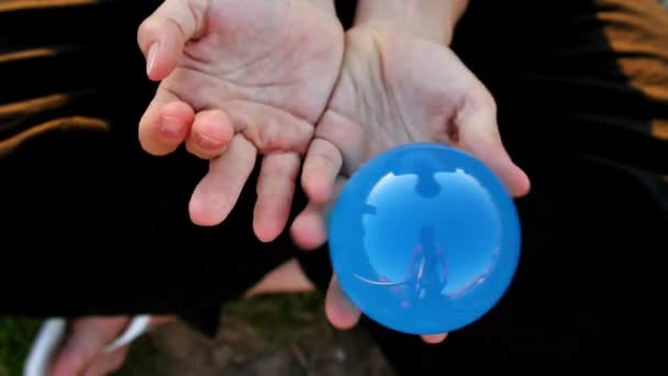 Woman Plays Contact Juggling Glass Transparent Ball — Stock videók