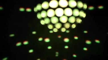 A colourful disco ball with lights and lasers effects