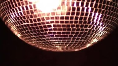 A colourful disco ball with lights and lasers effects