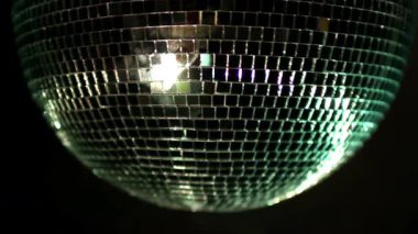 A colourful disco ball with lights and lasers effects