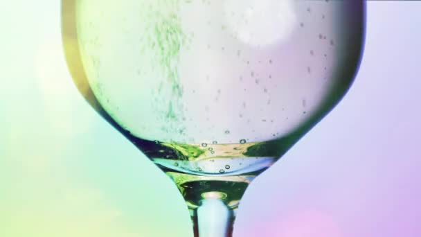 Champagne Bubbling Glass Colourful Soft Lights — Vídeo de stock