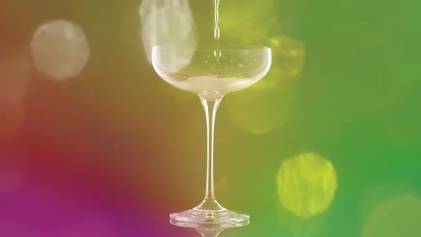 Pouring Champagne Glass Colourful Overlayed Lights — Vídeo de stock