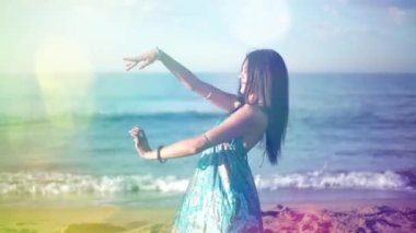 Beautiful balearic woman dancing at sunrise on a beach