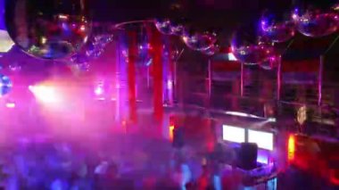 A timelapse of a crowd in a night club