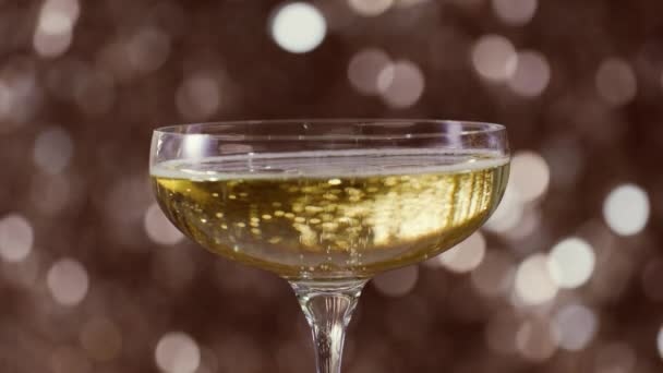 Champagne Glass Sparkling Golden Background — Vídeos de Stock