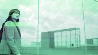 A smart woman walking up stairs with technology code overlayed