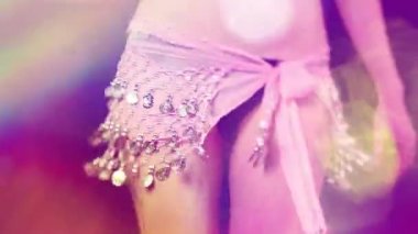 A dancer with a sparkling skirt and overlayed disco lights