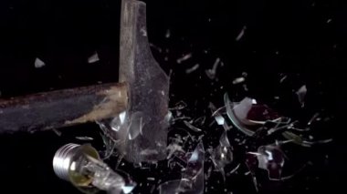 Light bulb smashed with a hammer shot in super slow motion