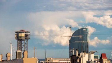 timelapse shot of the rooftops of barcelona shot from a terrace in the centre of the city with a storm making a beautiful rainbow