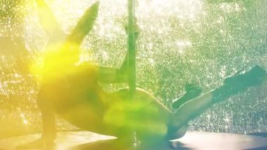 A female pole dancer with overlayed disco lights 