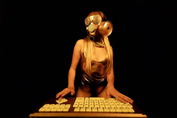 Woman Gold Gas Mask Typing Computer Stock Image