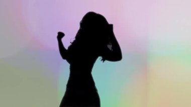 Beautiful female shadow silhouette dancer 