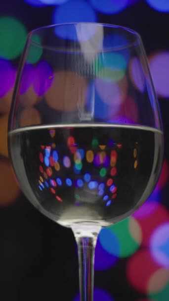 Glass White Wine Disco Lights Setting Vertical Video — Stock Video