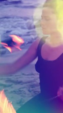 Bir kadın dikey olarak yangın performansı sergiler.