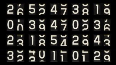 Durma hareketindeki analog saati büyük ızgara desenine dönüştürür