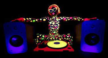 A cool dancing woman wearing UV fluorescent clothing and makeup with audio speakers clipart