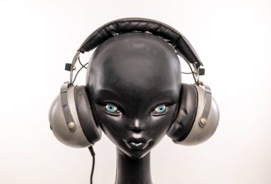 mannequin head with retro headphones clipart